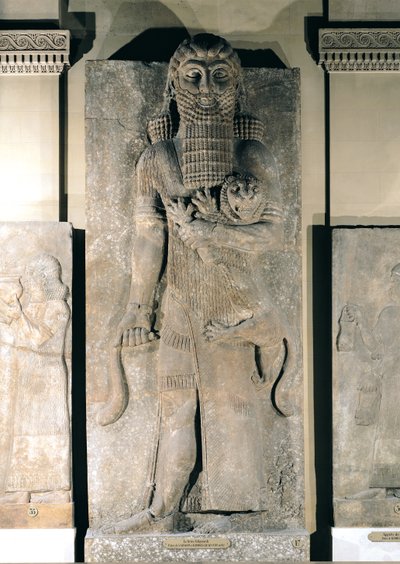 The hero Gilgamesh holding a lion that he has captured, stone relief from the Palace of Sargon II at Khorsabad (Iraq), c.725 BC by Assyrian School